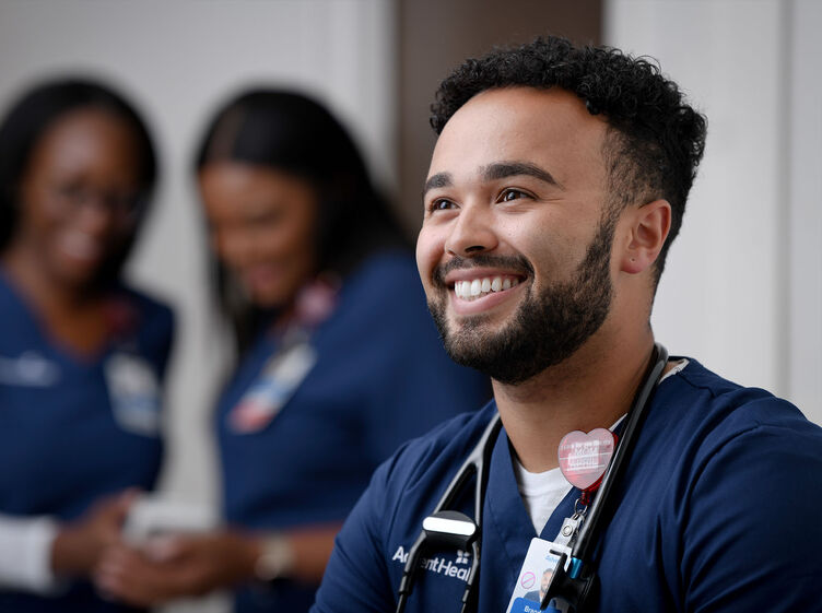 A young male nurse smiling