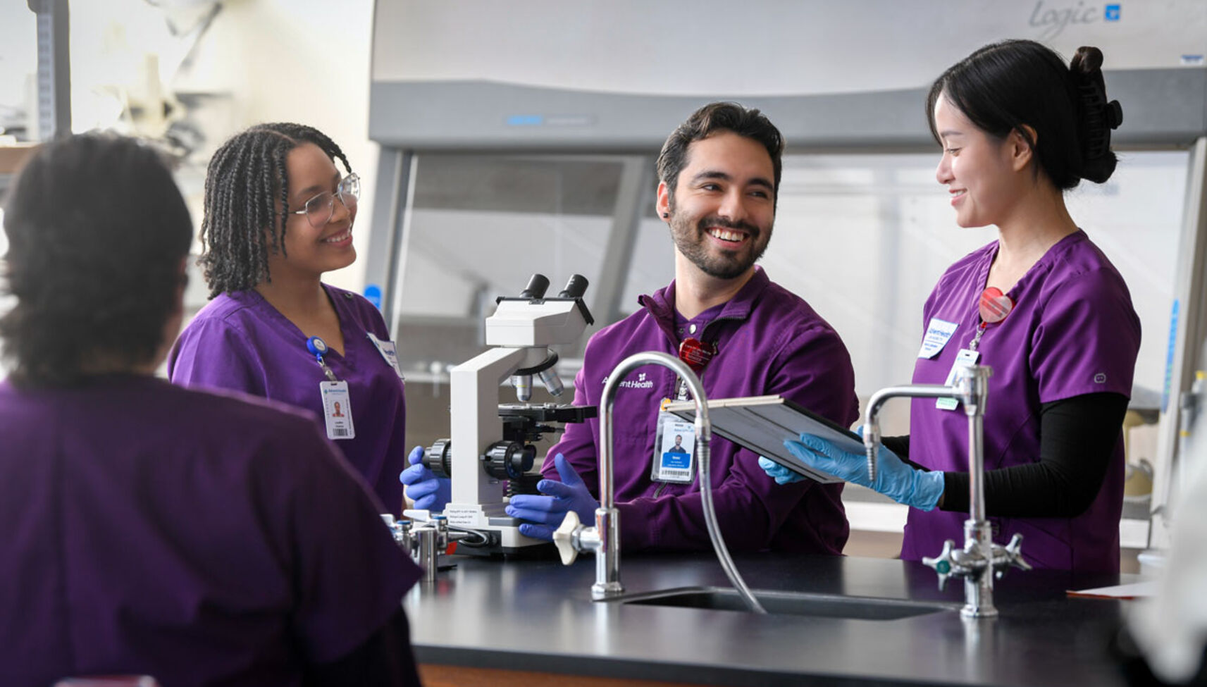 three students smiling in the lab