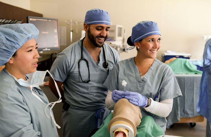 Nurse anesthesia students practicing intubation procedures in the skills lab