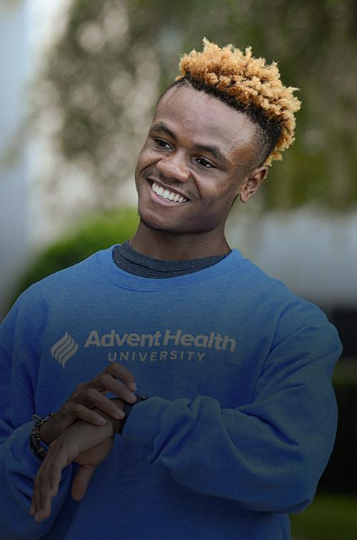 A student wearing an AHU sweater
