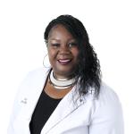 smiling nursing faculty in white lab coat