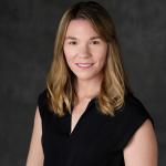 faculty member smiling