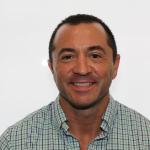 Male faculty member smiling