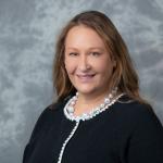 Faculty member smiling