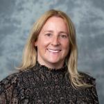 Faculty member smiling