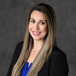 Faculty member smiling