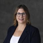 Faculty member smiling