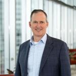 Board of Trustees member Doug Hilliard smiling