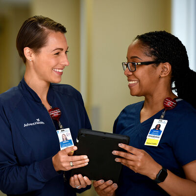 Two young female nurses working together in a hospital