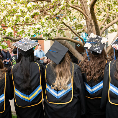 A group of graduates from AHU Denver