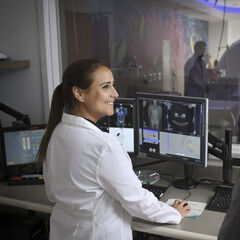 A nuclear medicine technologist conducting a PET scan