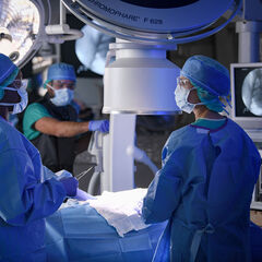 Surgeons and radiographers in an operating room