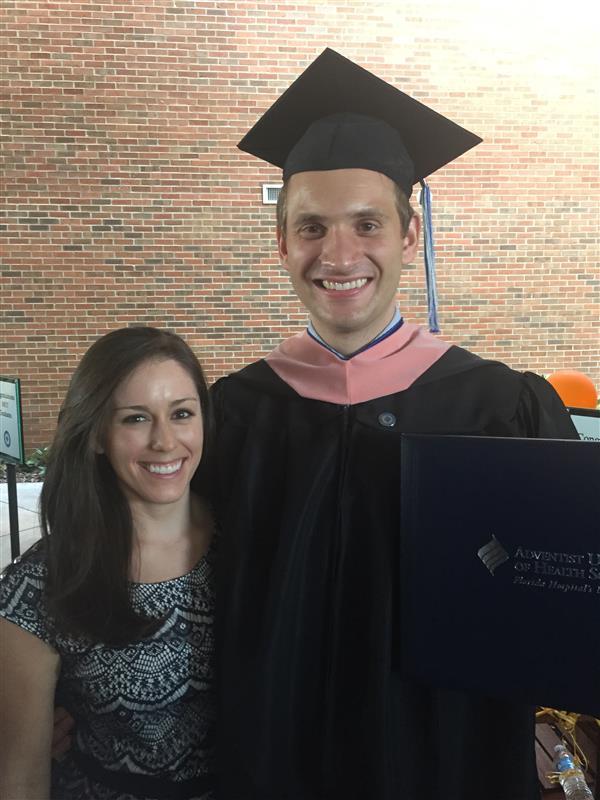 image of male graduate and woman smiling