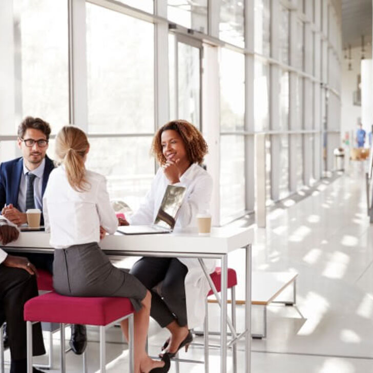healthcare-administrators-sit-around-a-table