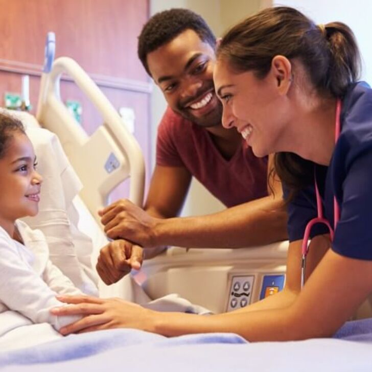 nurse-comforts-pediatric-patient