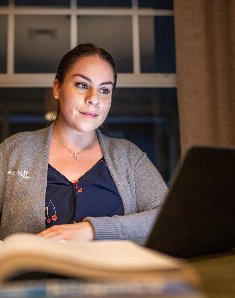 Nurse studying on a laptop