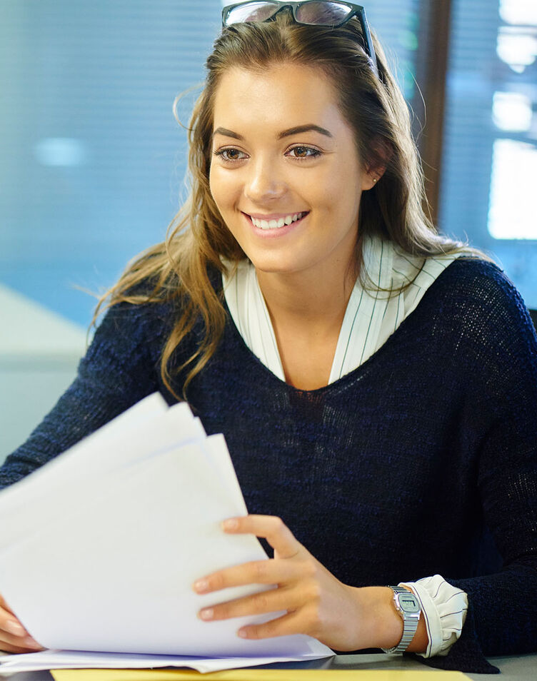 A student meeting with a university staff member in an office