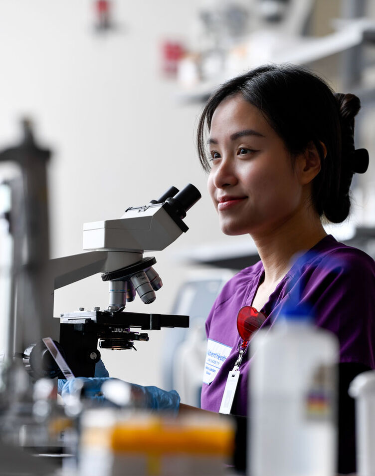 MLS student smiling in lab